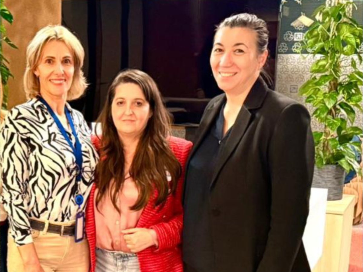 Three colleagues from the GIS team, at an event
